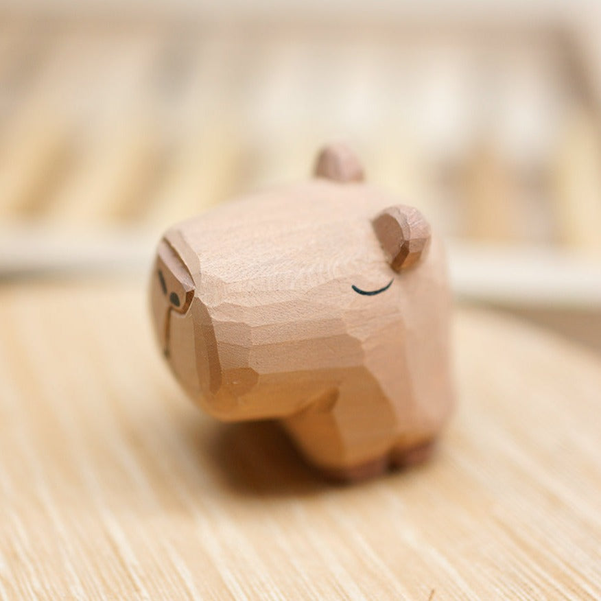 Capybara figurine, hand-carved in unpainted wood.