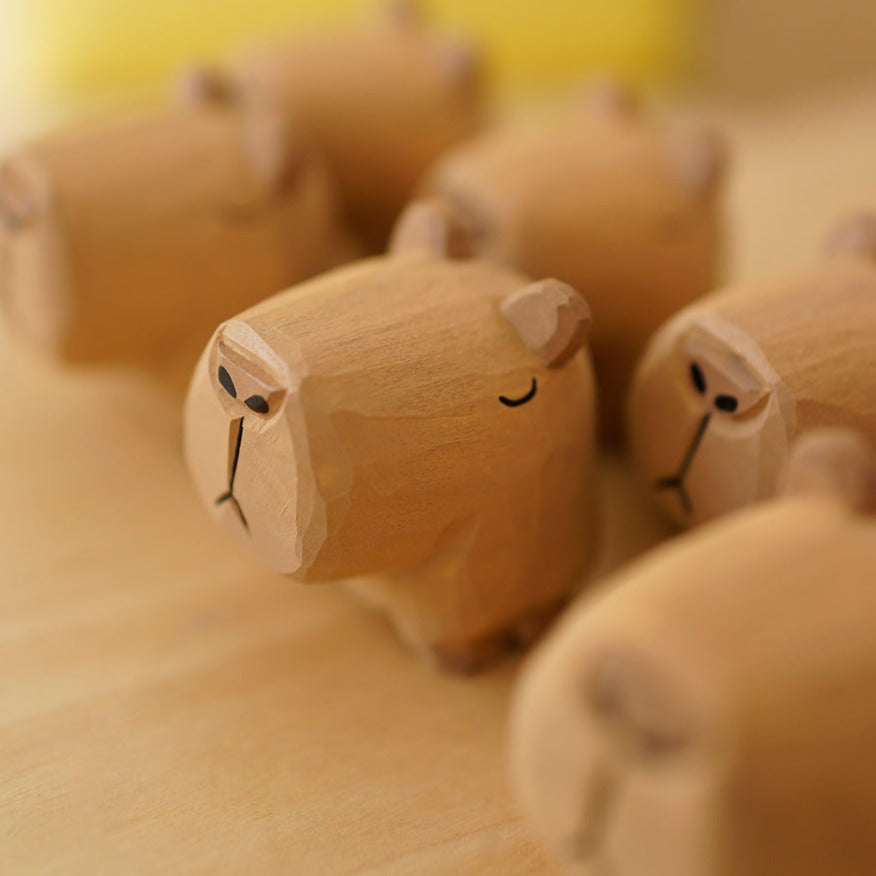 Capybara statues, hand-carved from wood.