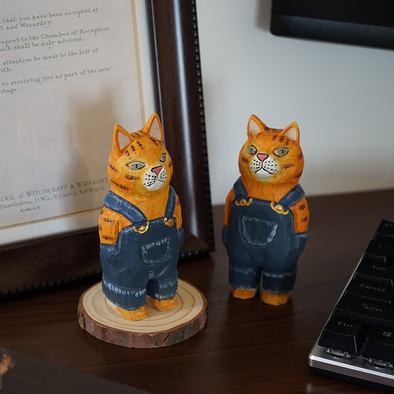 Side view of denim cat sculpture, hand-painted wooden figurine