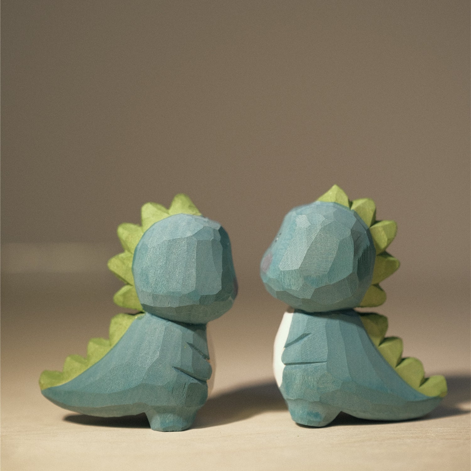 Two kawaii dinosaur figurines placed together, suitable for decoration or gift.