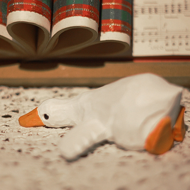 Side close-up of a wooden duck figure.