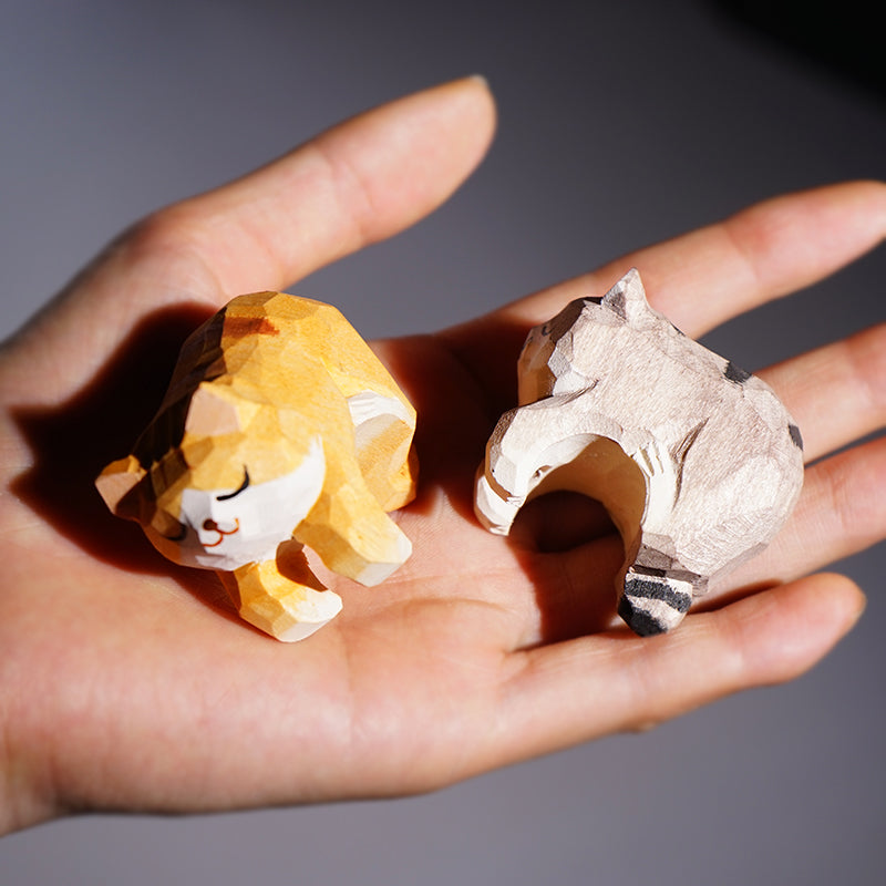 Close-up of miniature cat figurines