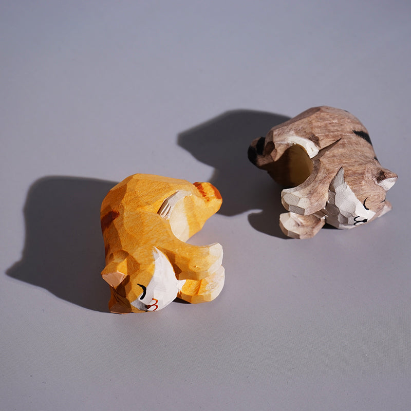 Side view of mini cat figurines