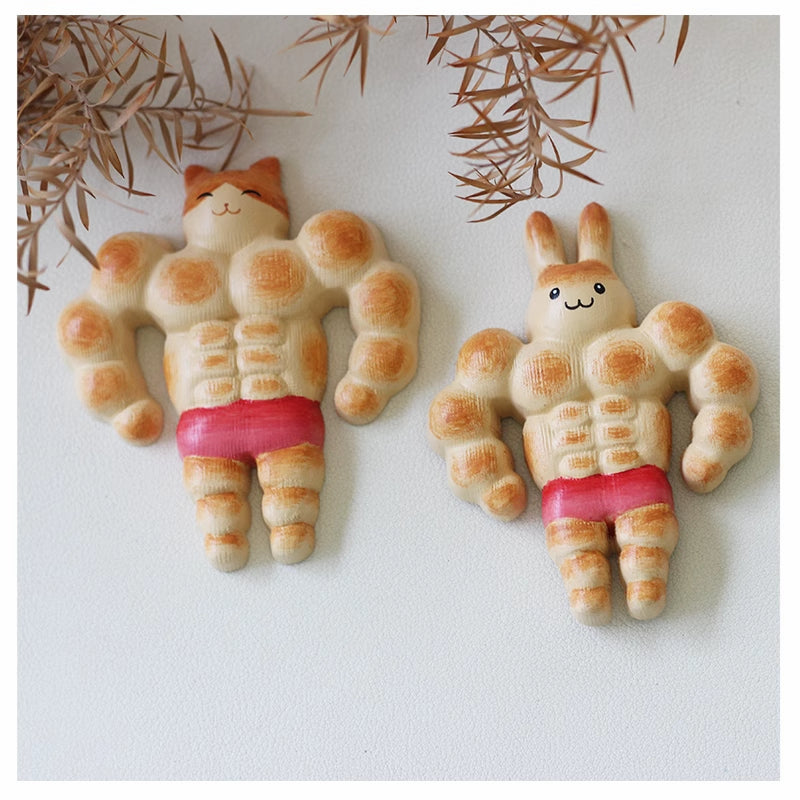 Artistic bread-shaped fridge magnets depicting a cat and bunny with muscles.