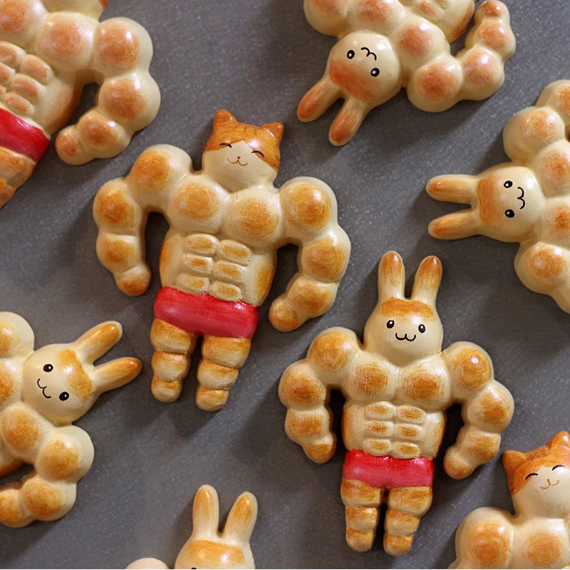 Adorable muscle bread cat and bunny fridge magnets on a grey background.