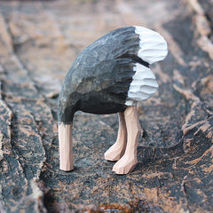 Lifelike ostrich wood sculpture with realistic paint details