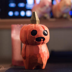 Crafted wooden pumpkin figure with a unique geometric design.