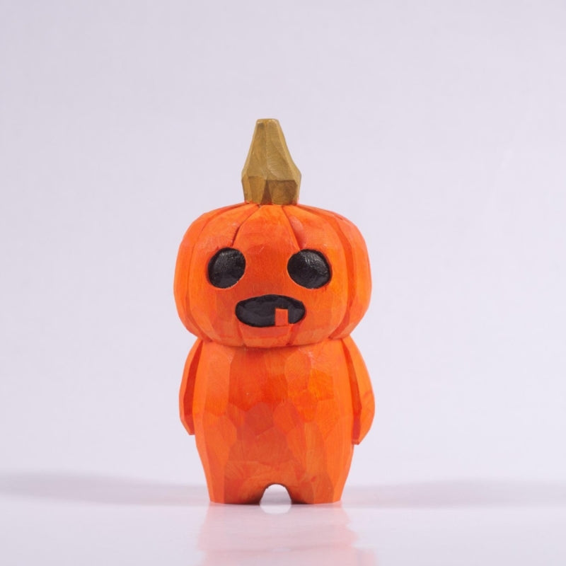 Hand-carved wooden pumpkin head figurine with a natural finish.