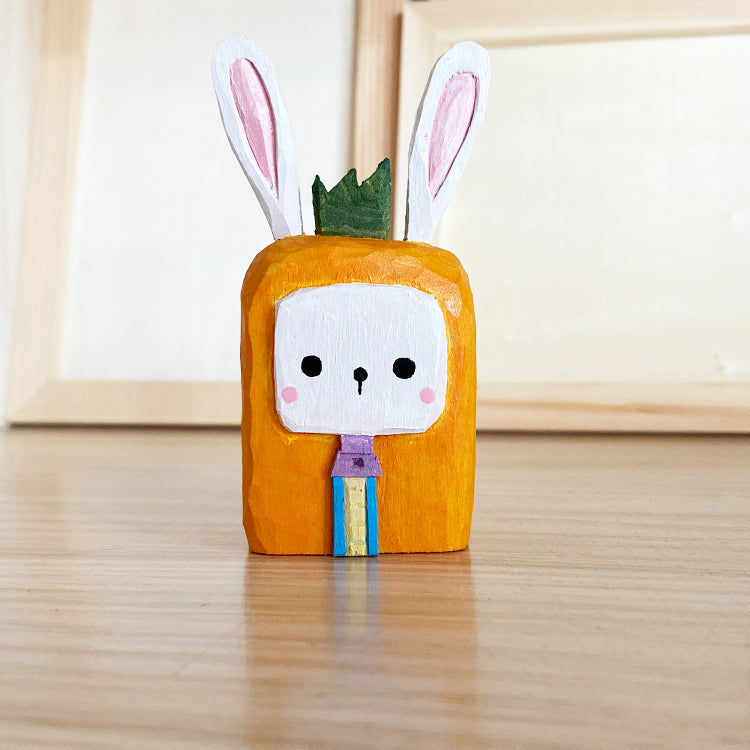 Square cartoon style bunny, a hand-painted wooden toy.