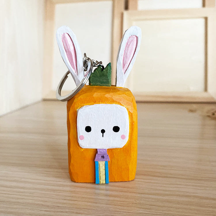 Square cartoon style bunny statue, made into a keychain.