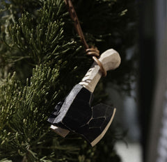 Wooden toy axe as an ornament to hang on the Christmas tree.