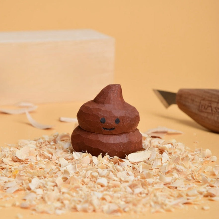 Cheerful wooden poop toy on a yellow background, highlighting its unique and humorous design.