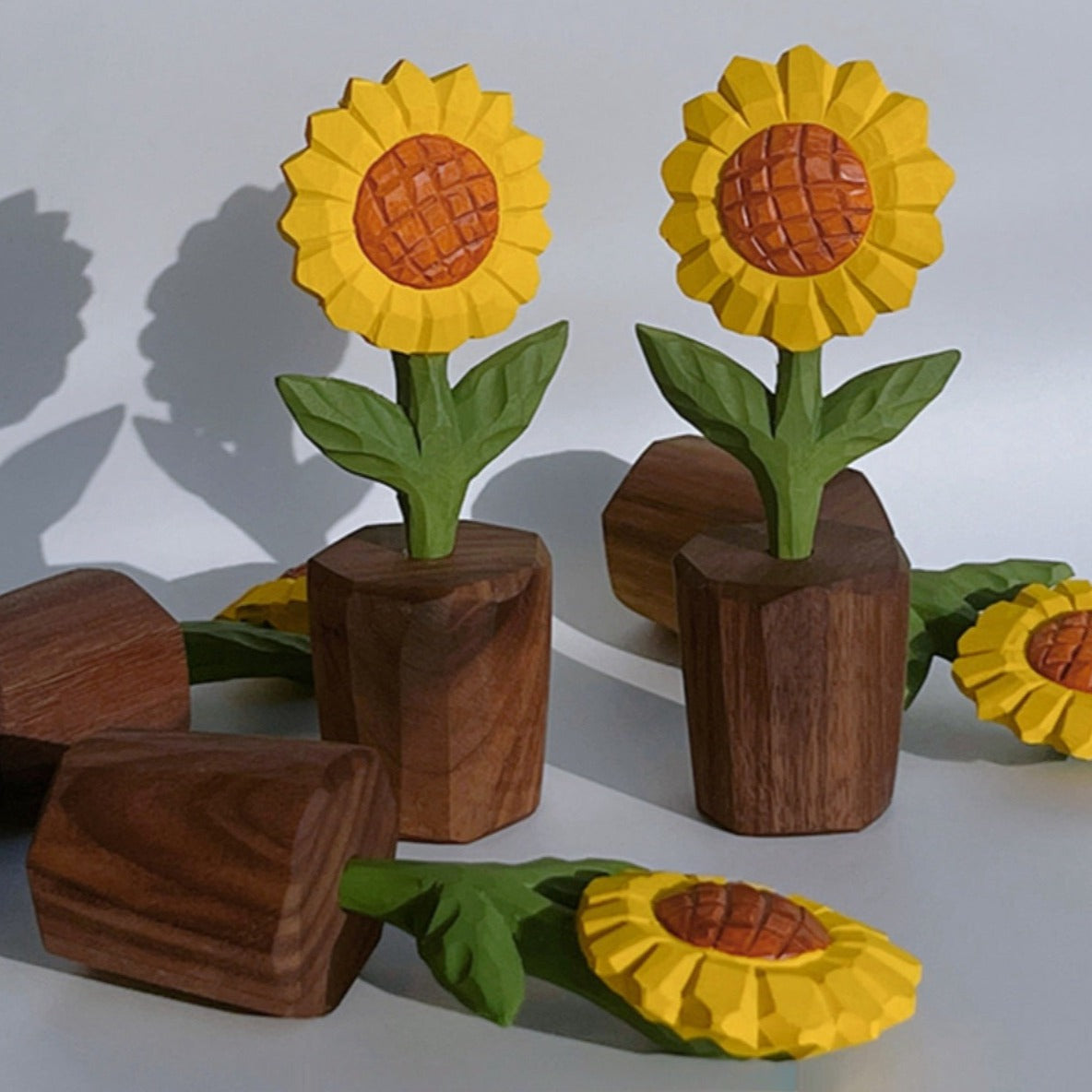 Artistic wooden sunflower sculpture with intricate hand-carved details in vibrant yellow.